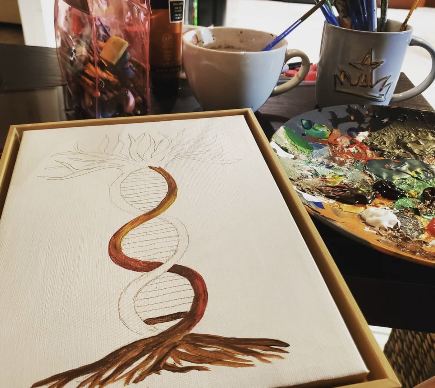 JoA painting a piece in progress in her studio